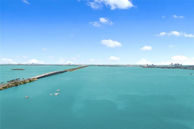 a balcony with chairs and wooden floor