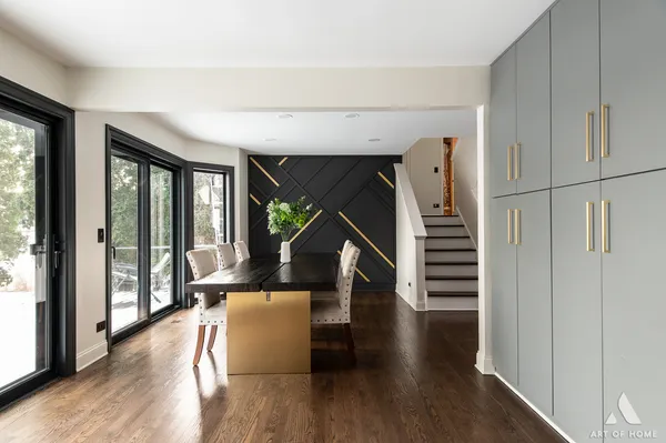 a view of entryway and hall with wooden floor