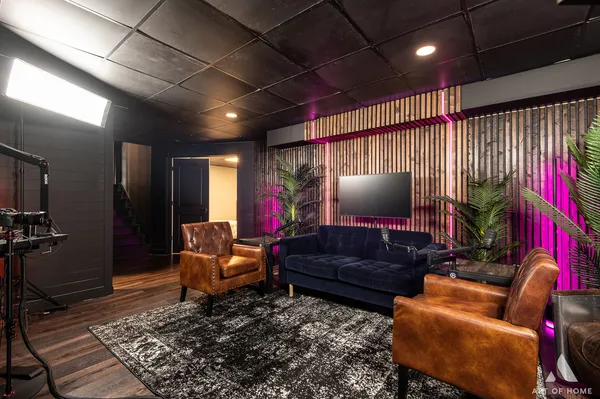 a bedroom with a bed and a wooden floor