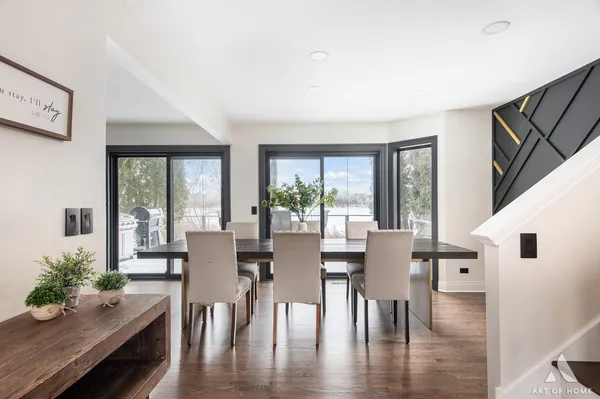 a view of a dining room with furniture window and wooden floor