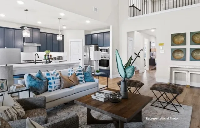 a kitchen with kitchen island stainless steel appliances a sink stove and refrigerator