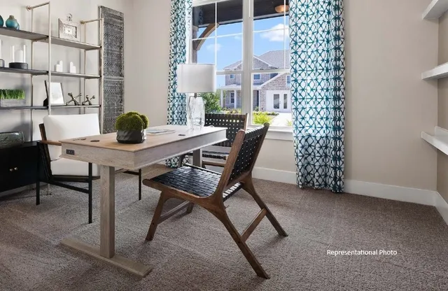 a bedroom with bed and a large window