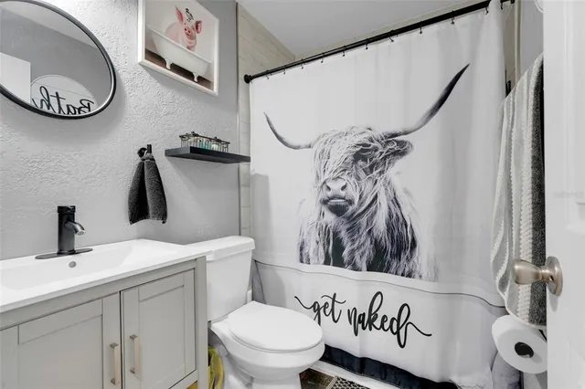 a bathroom with a toilet and a sink