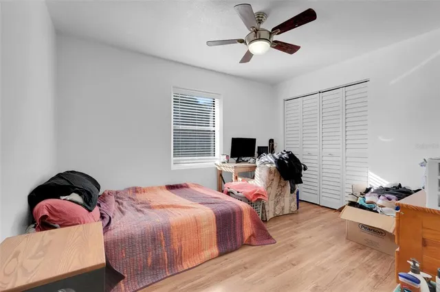 a bedroom with furniture and a window