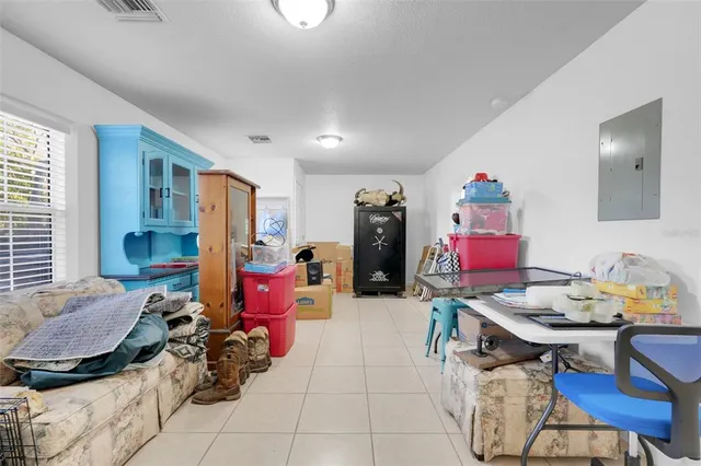 a living room with furniture and a table