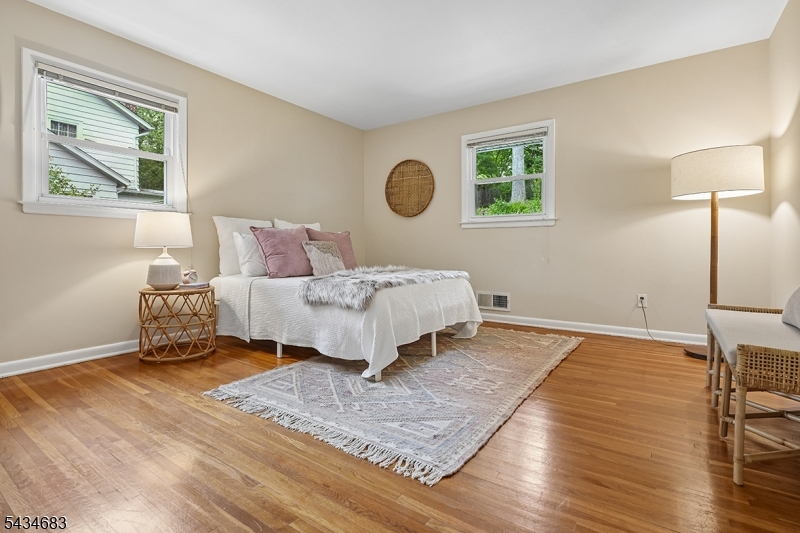 106 Division Avenue Summit, NJ 07901 - Photo 20 of 38 a bedroom with a bed and a window
