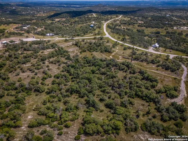 a view of a yard with wooden floor
