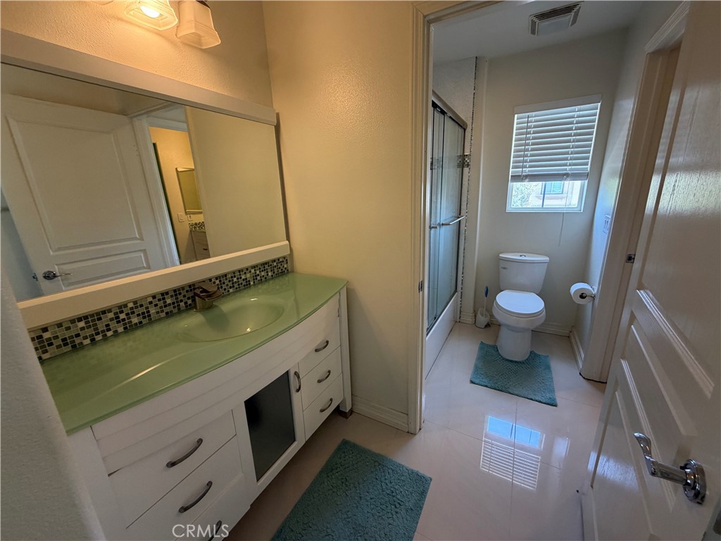 19823 Mariposa Pines Way Porter Ranch, CA 91326 - Photo 34 of 50 a bathroom with a sink and a mirror