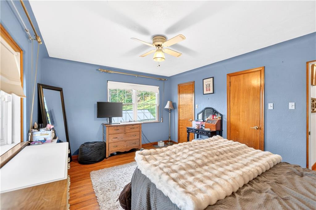 1188 Willowbrook Road Belle Vernon, PA 15012 - Photo 43 of 50 a bedroom with a bed and a chandelier