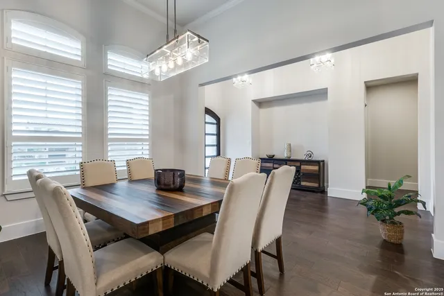 a view of a dining room with furniture and window