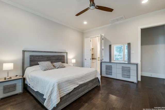 a bedroom with a bed and a dresser