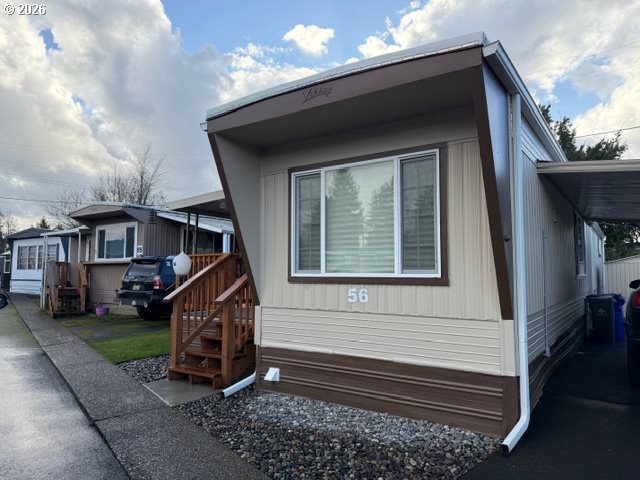 16901 Southeast Division Street Portland, OR 97236 - Photo 11 of 14 a front view of a house with a yard