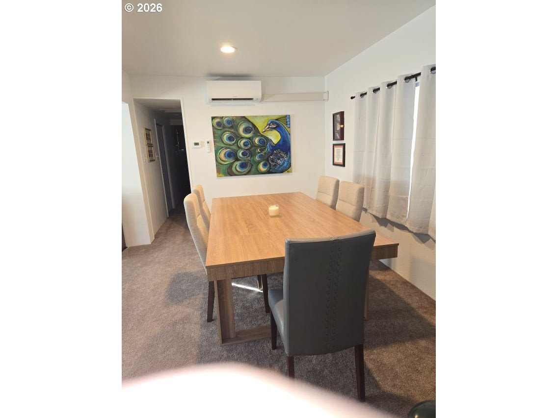 16901 Southeast Division Street Portland, OR 97236 - Photo 5 of 14 a living room with furniture and a large window