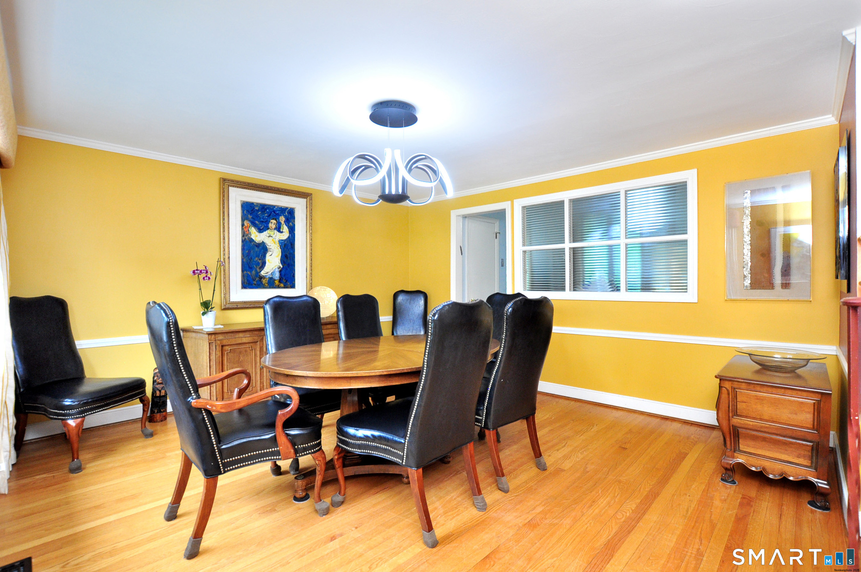 44 Miamis Road West Hartford, CT 06117 - Photo 11 of 39 a view of a dining room with furniture and wooden floor