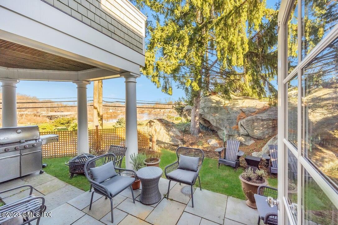 1 Home Place, Unit A Greenwich, CT 06830 - Photo 15 of 22 a building outdoor space with patio furniture and potted plants