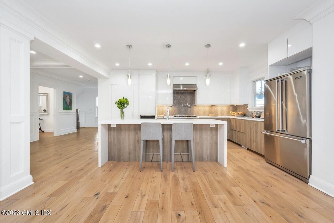 1 Home Place, Unit A Greenwich, CT 06830 - Photo 6 of 22 a kitchen with a sink appliances and cabinets