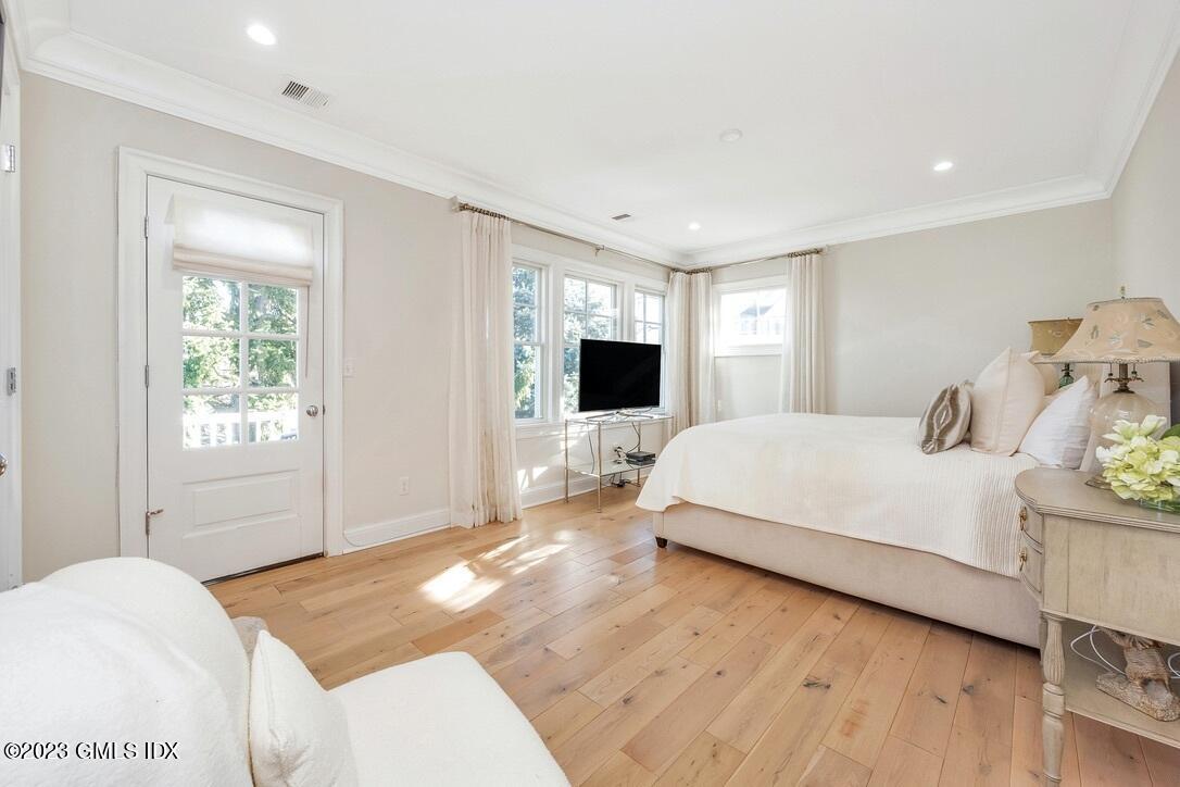 1 Home Place, Unit A Greenwich, CT 06830 - Photo 10 of 22 a spacious bedroom with a bed and a flat screen tv