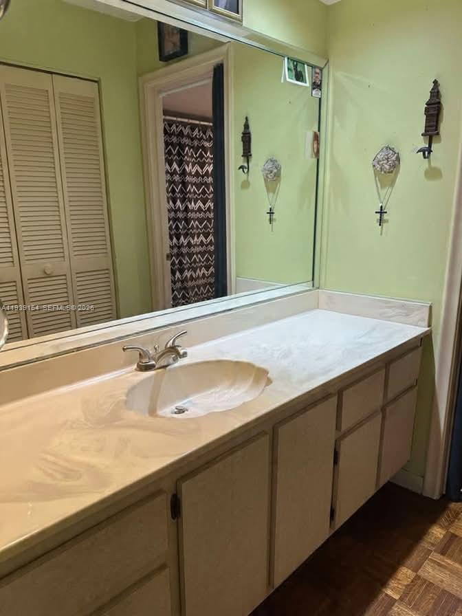 11438 Southwest 86th Lane Miami, FL 33173 - Photo 13 of 17 a bathroom with a granite countertop sink and a mirror