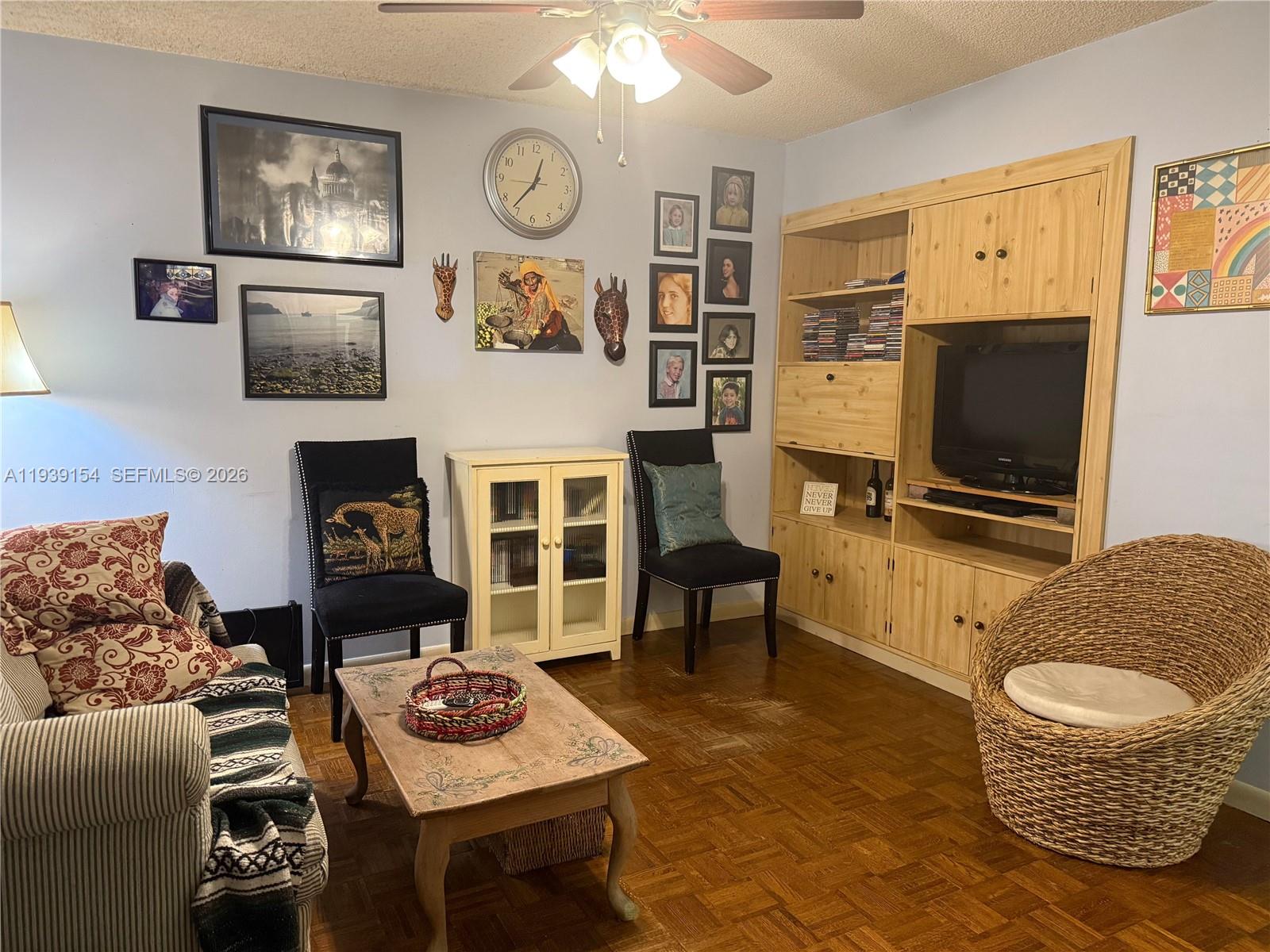 11438 Southwest 86th Lane Miami, FL 33173 - Photo 5 of 17 a living room with furniture and a flat screen tv