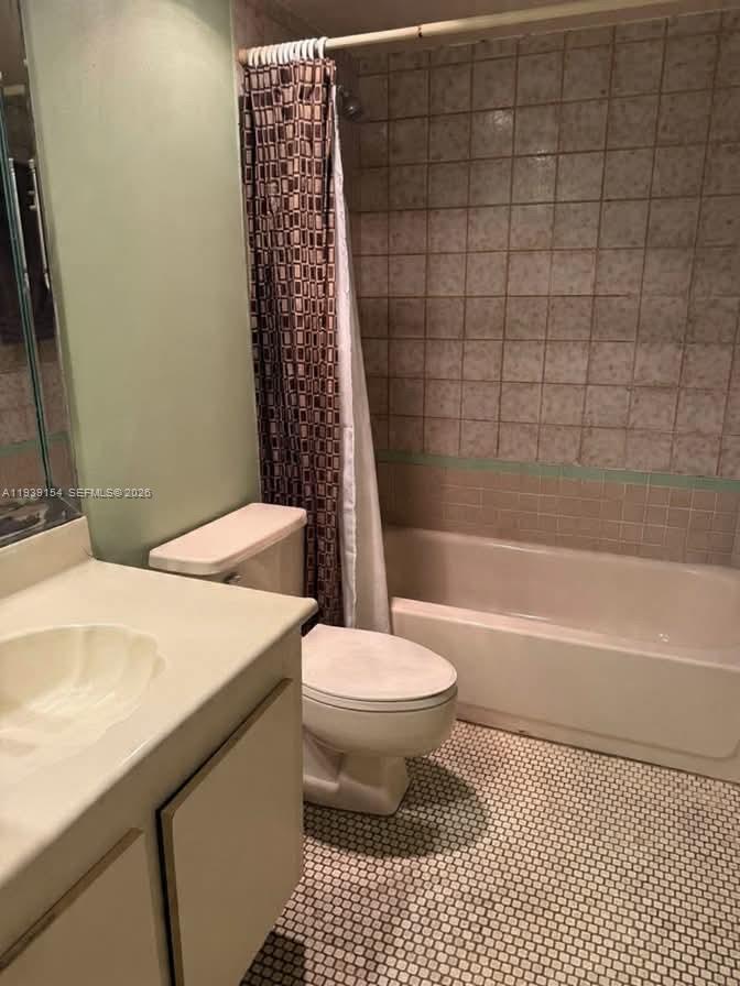 11438 Southwest 86th Lane Miami, FL 33173 - Photo 6 of 17 a bathroom with a sink a toilet and shower