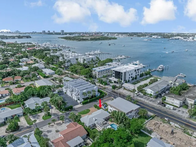 an aerial view of a house with a lake view