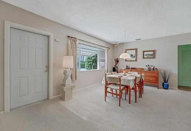 a view of a livingroom with furniture and window