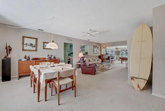 a view of a livingroom with furniture and a window