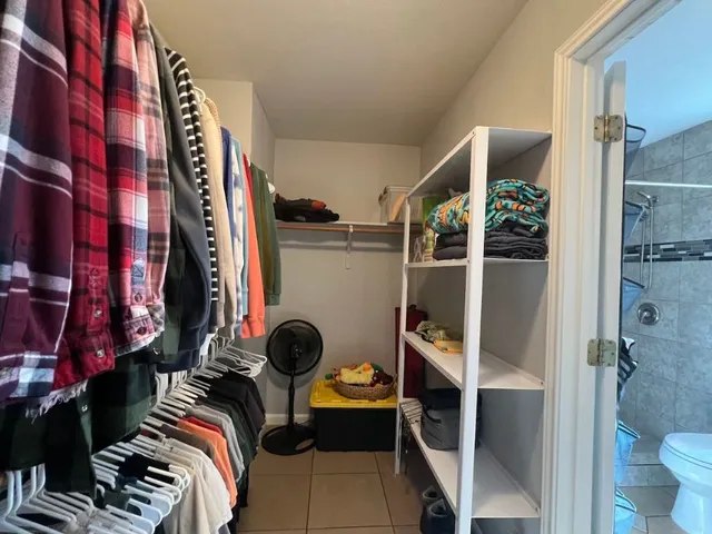 a front view of a house with yard and green space