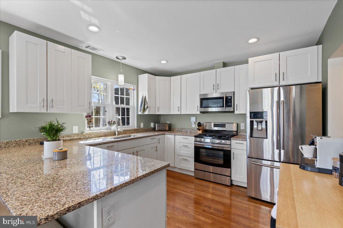 435 Kenneth Square Baltimore, MD 21212 - Photo 13 of 35 a kitchen with stainless steel appliances granite countertop a refrigerator sink and stove