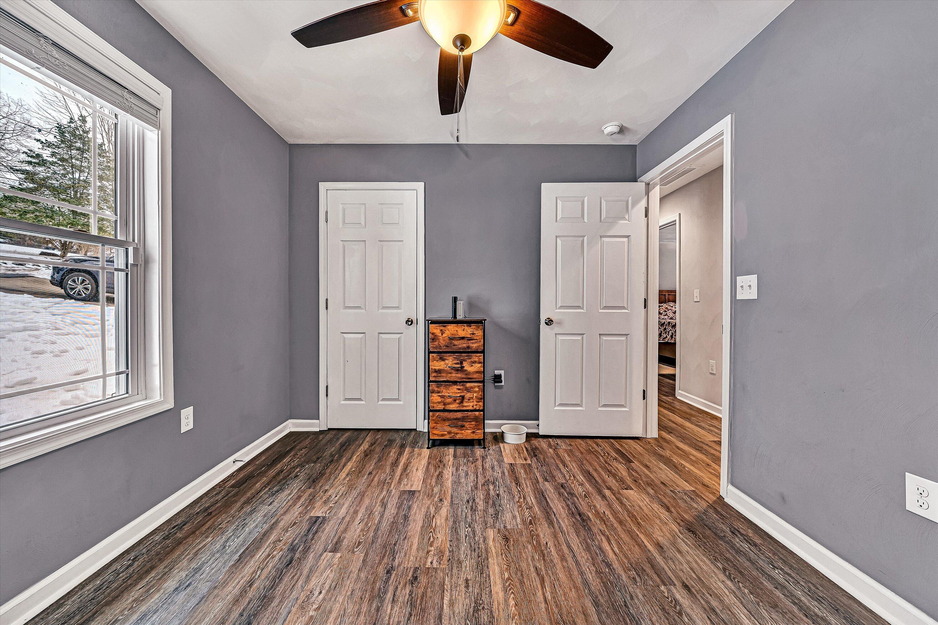 2111 Woodland Road Southeast Roanoke, VA 24014 - Photo 16 of 31 wooden floor in an empty room with a window