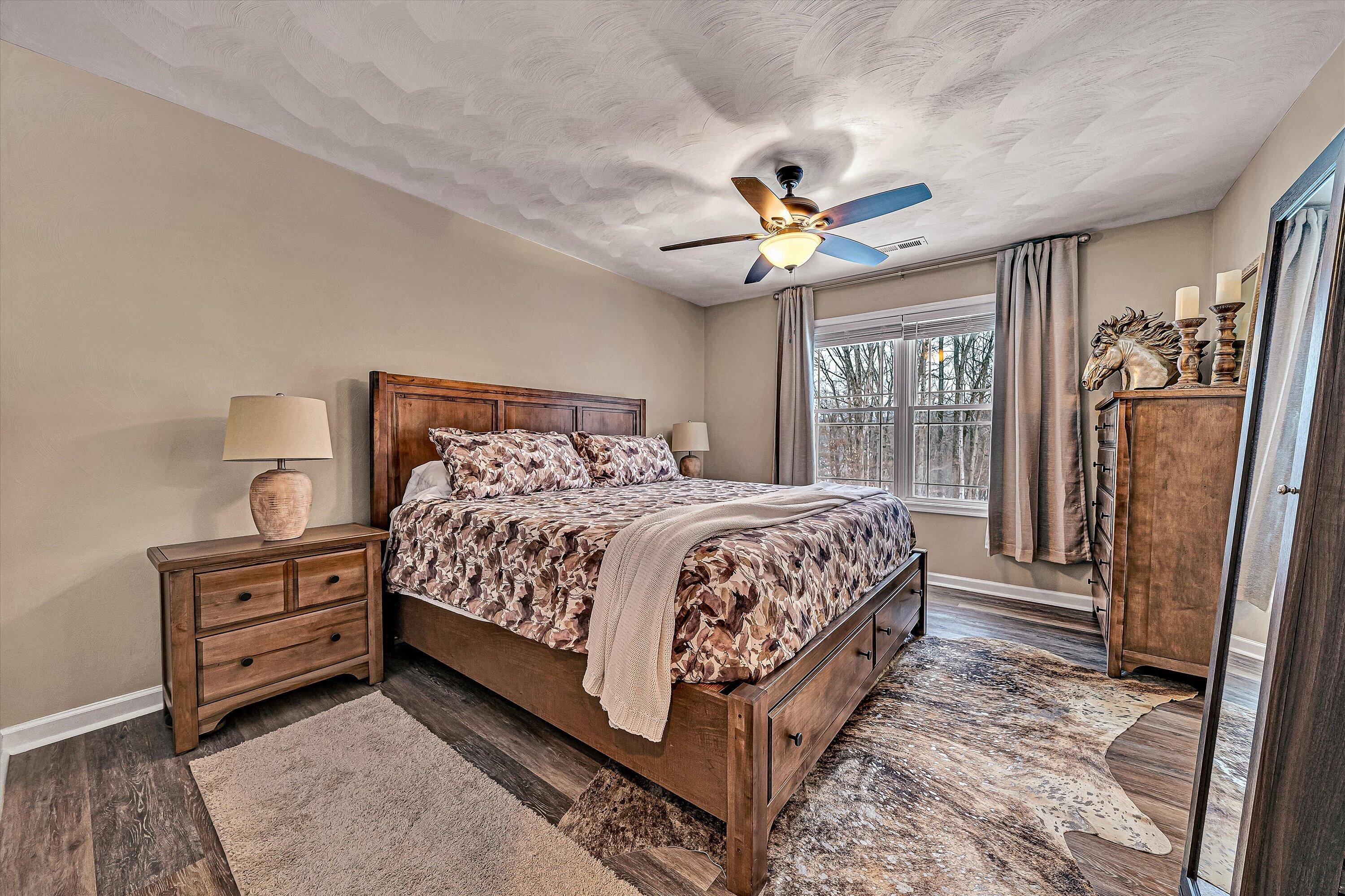 2111 Woodland Road Southeast Roanoke, VA 24014 - Photo 19 of 31 a bedroom with a bed dresser and a window