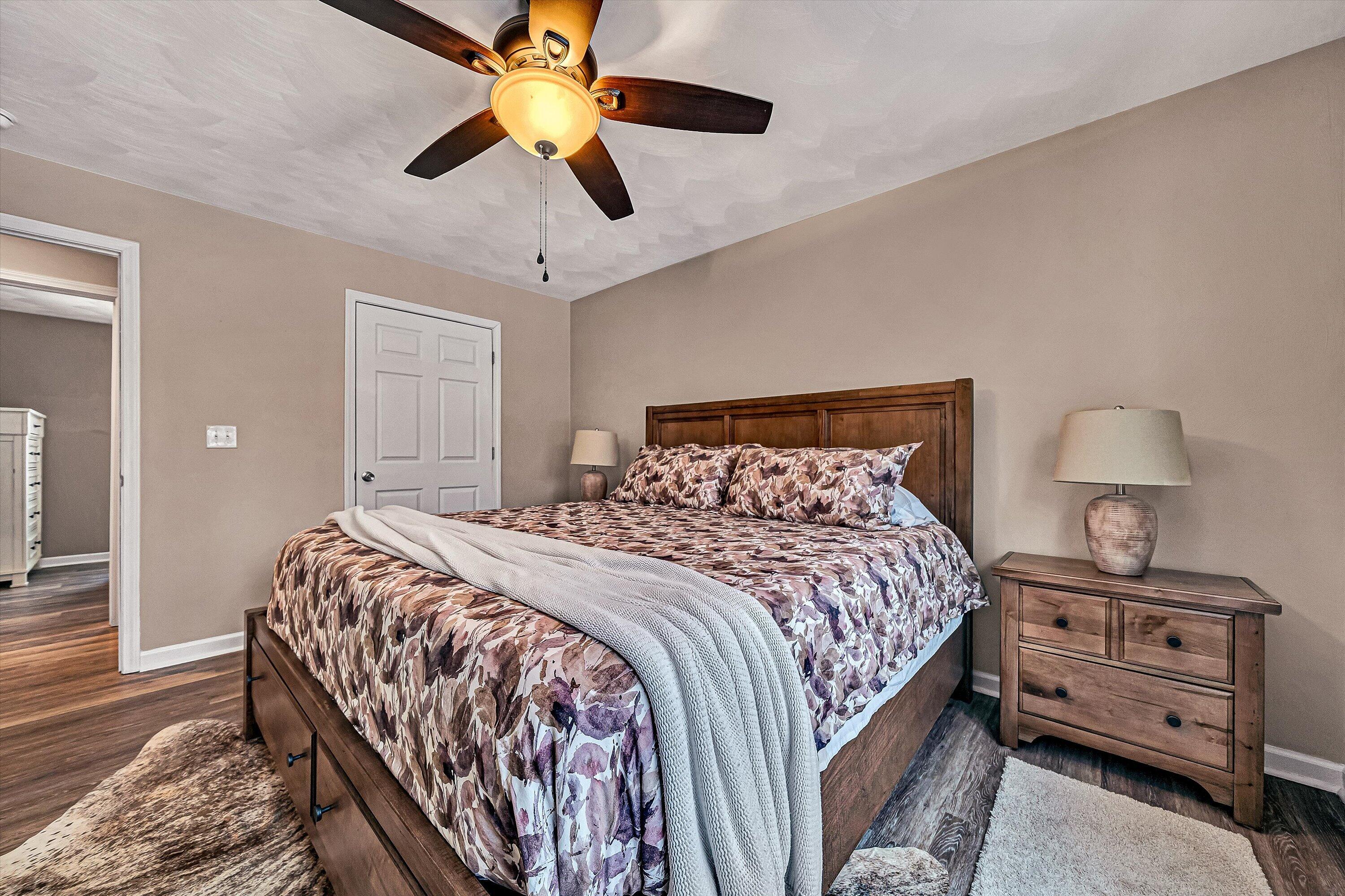2111 Woodland Road Southeast Roanoke, VA 24014 - Photo 20 of 31 a bedroom with a bed and a ceiling fan