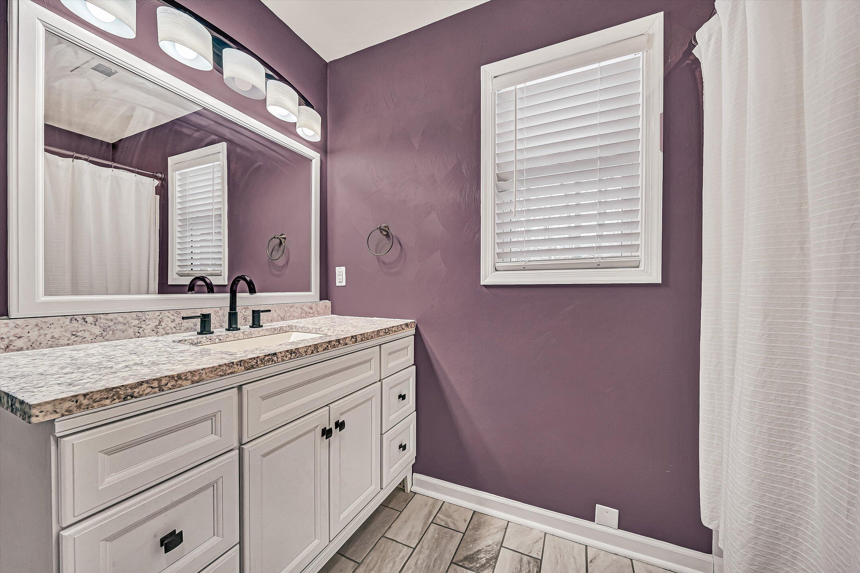2111 Woodland Road Southeast Roanoke, VA 24014 - Photo 23 of 31 a bathroom with a granite countertop sink and a mirror