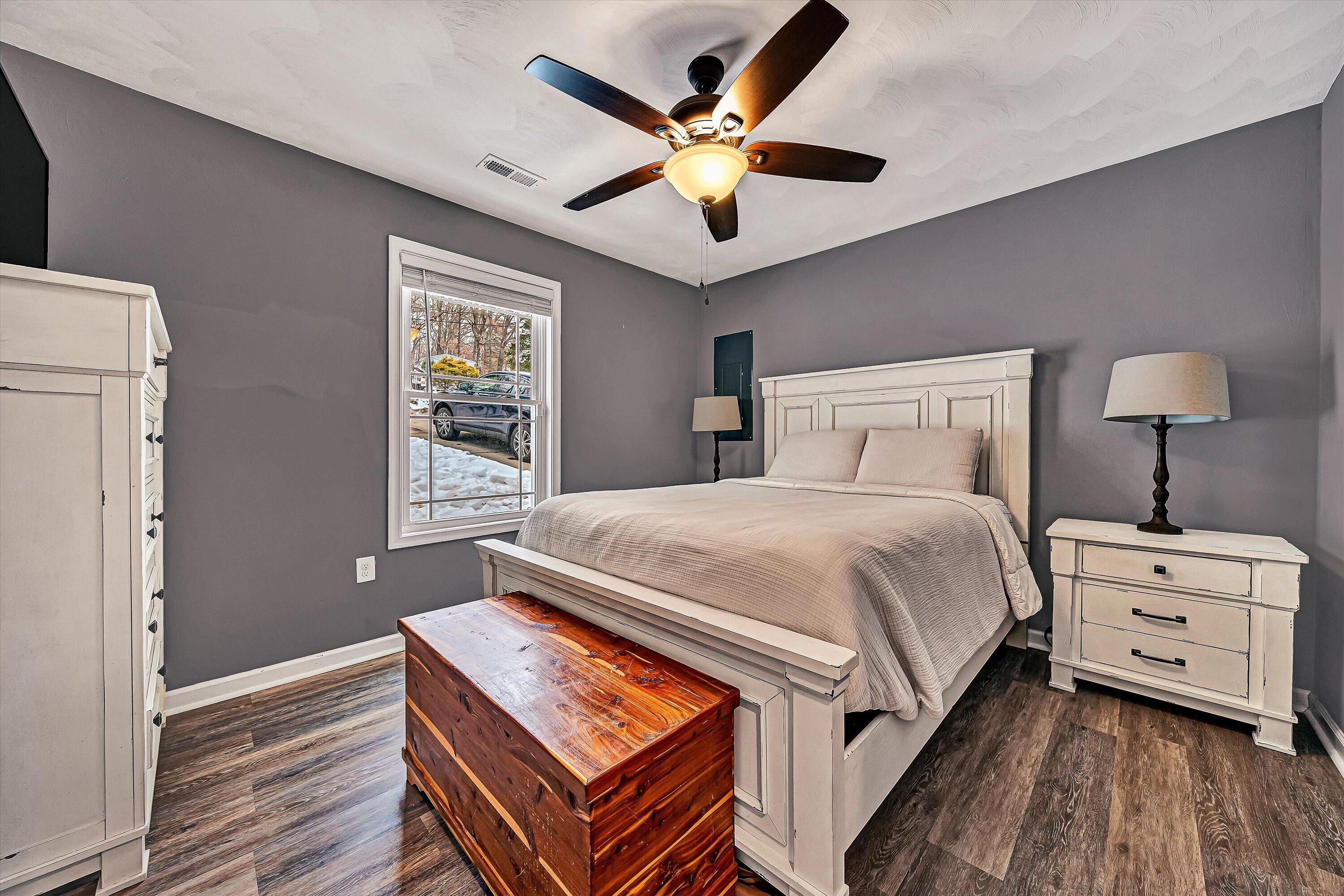 2111 Woodland Road Southeast Roanoke, VA 24014 - Photo 24 of 31 a bedroom with a bed and a ceiling fan