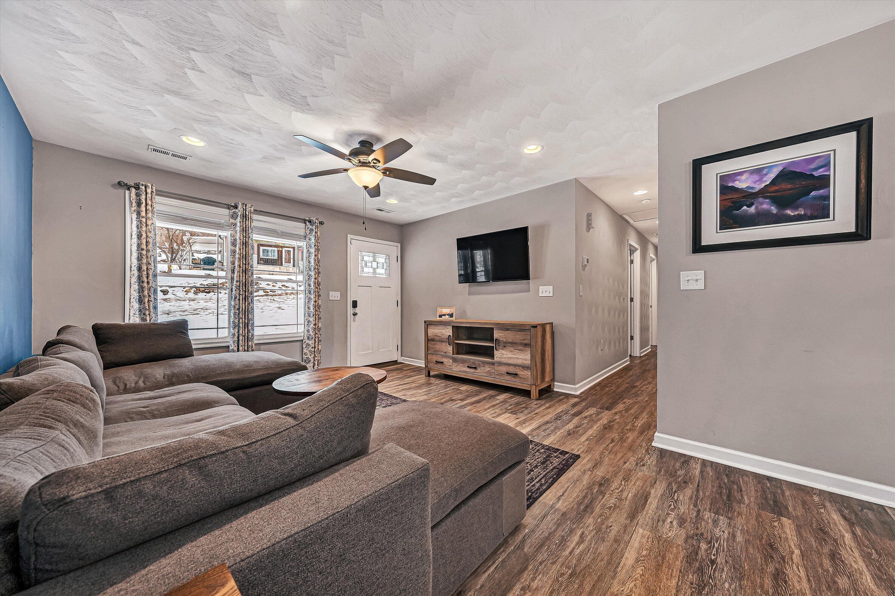 2111 Woodland Road Southeast Roanoke, VA 24014 - Photo 5 of 31 a living room with furniture and a fireplace
