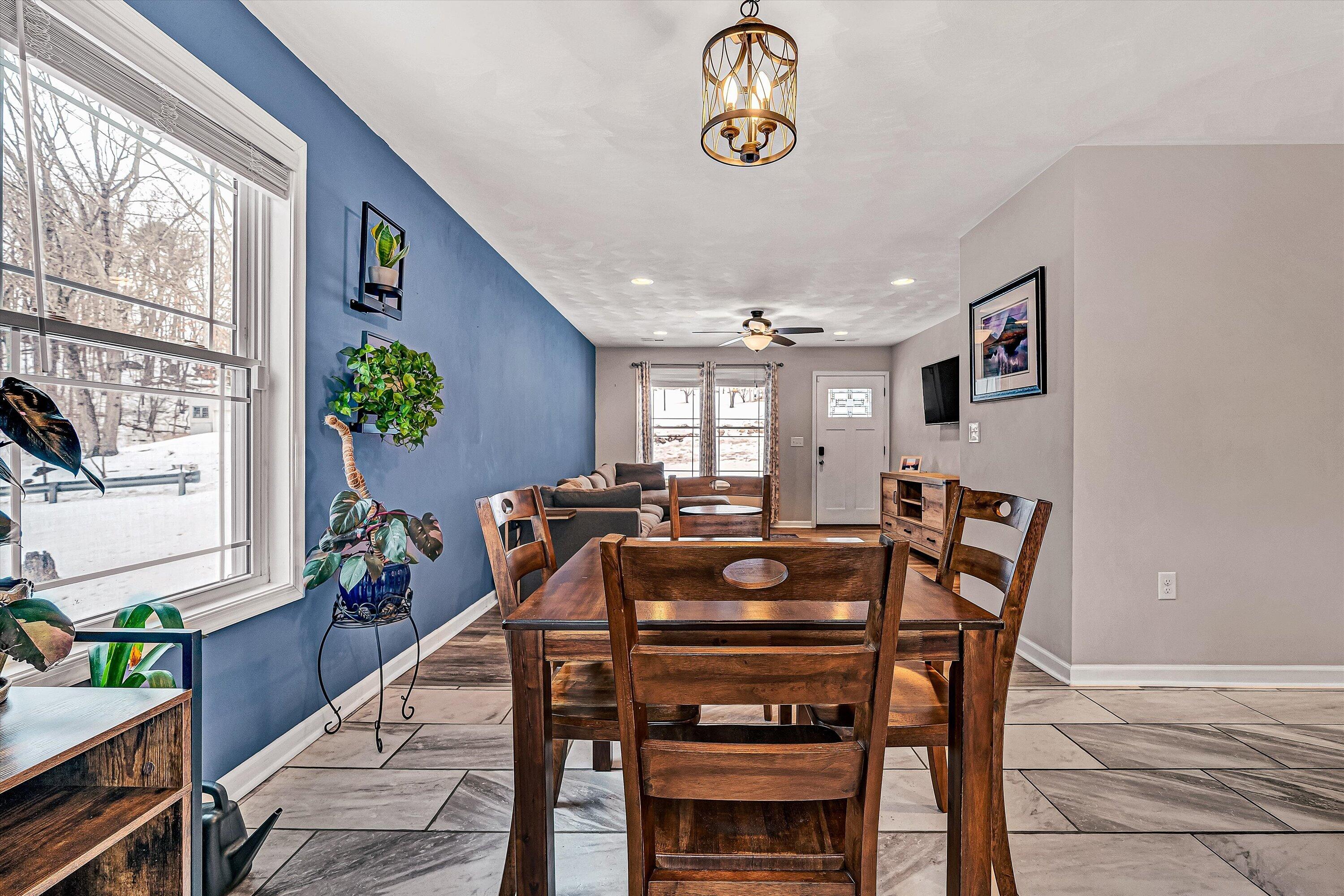 2111 Woodland Road Southeast Roanoke, VA 24014 - Photo 6 of 31 a view of a dining room with furniture window and wooden floor
