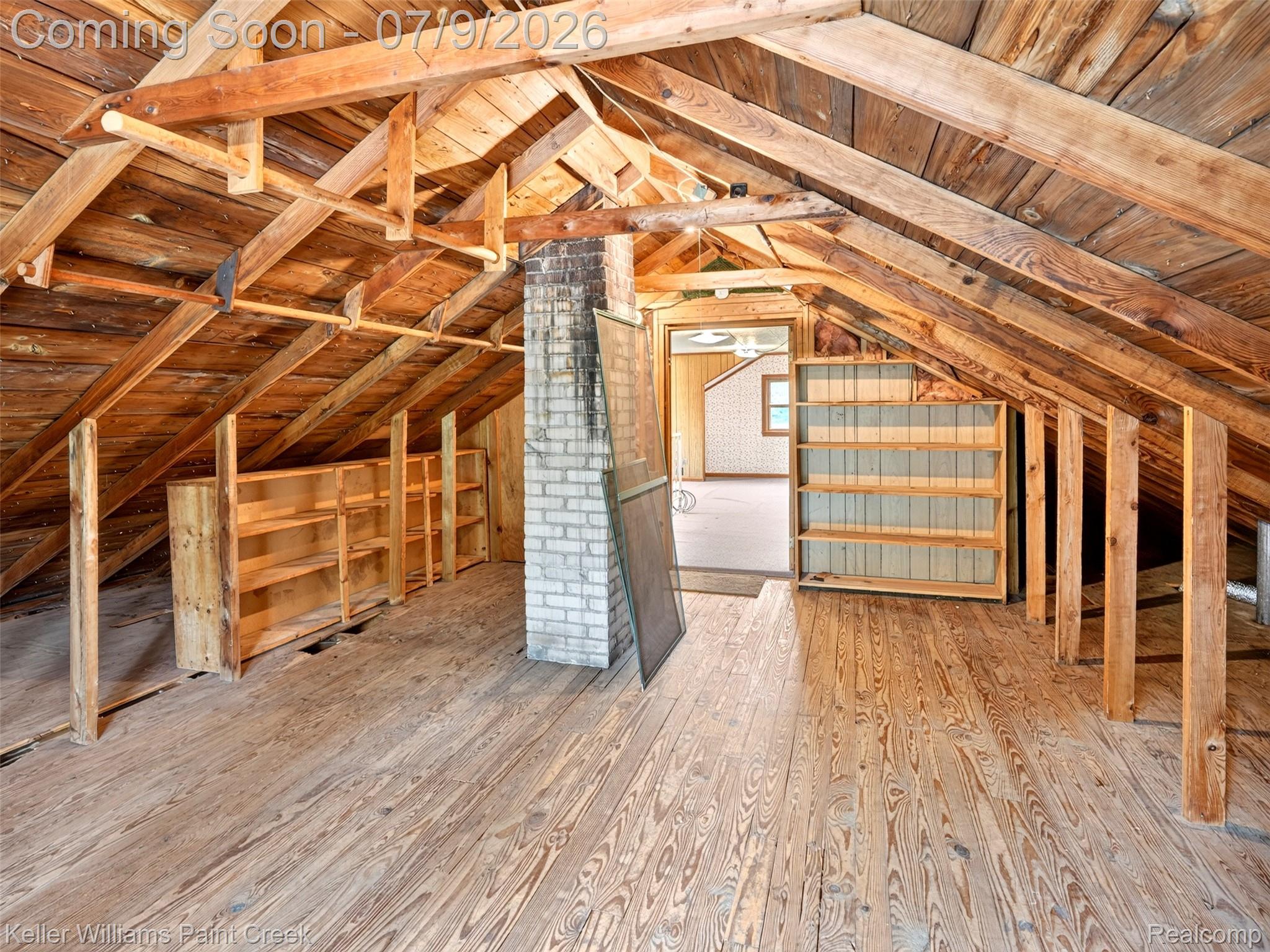 204 Russell Road Kawkawlin, MI 48631 - Photo 43 of 82 Exposed wood beam ceiling with wood-plank flooring