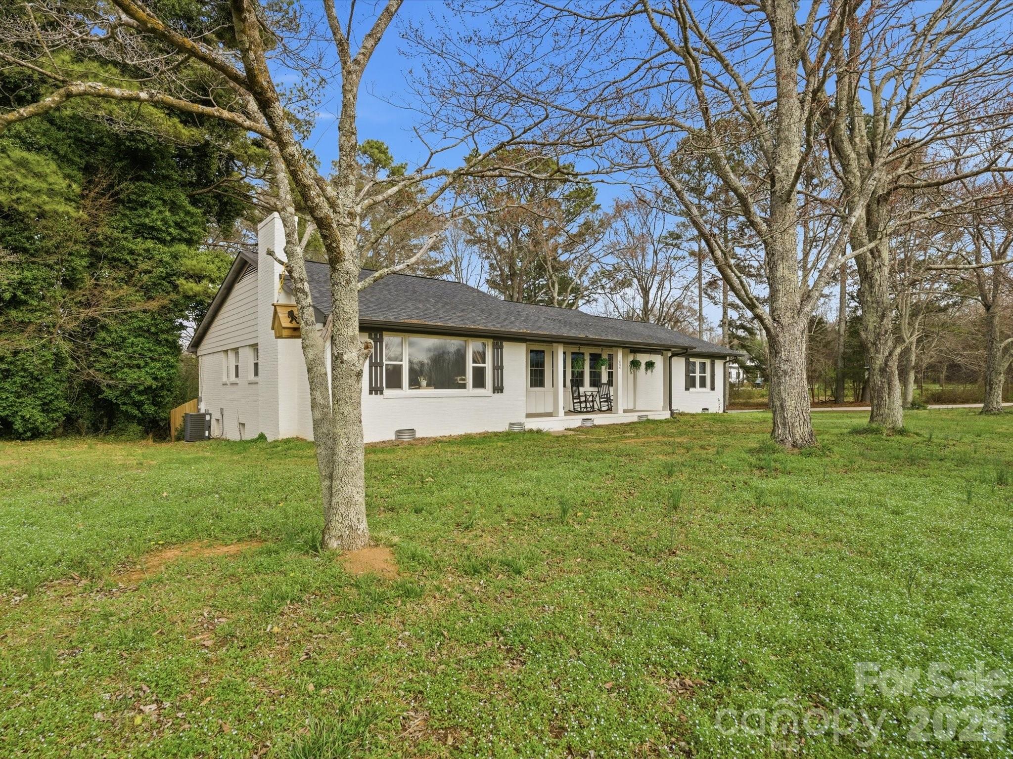 1804 Highway 161, Unit 1 Clover, SC 29710 - Photo 45 of 46 a view of a house with a big yard and large trees