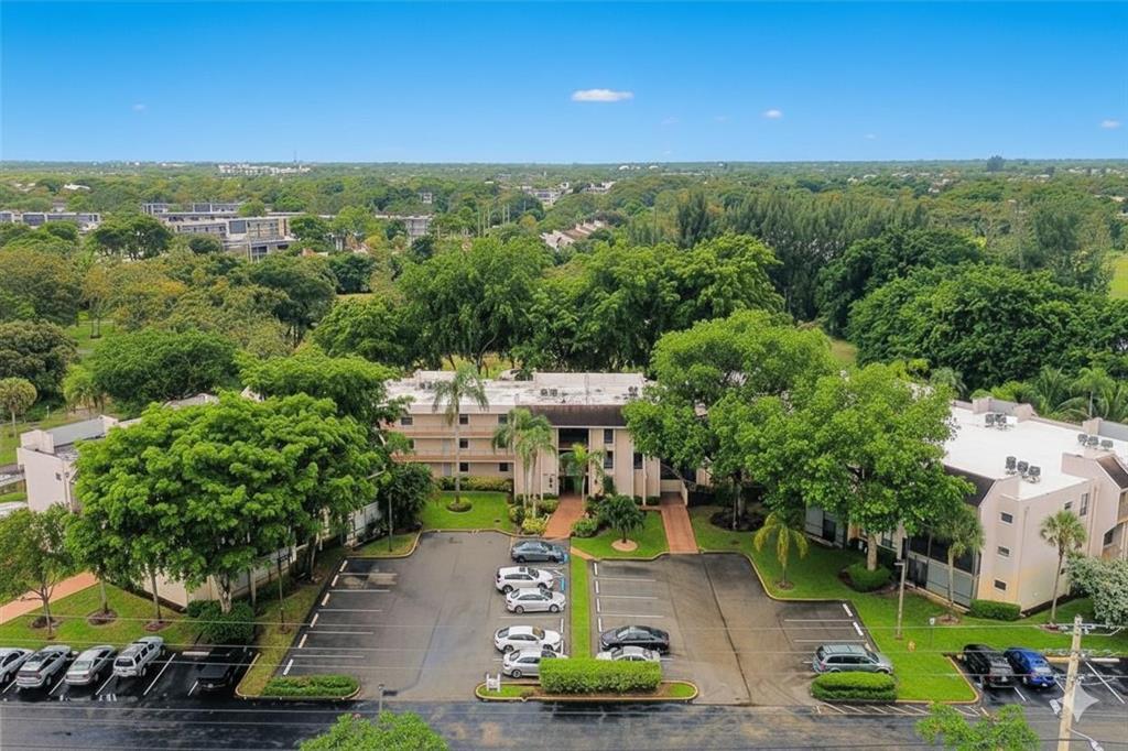 8150 West McNab Road, Unit 312 Tamarac, FL 33321 - Photo 1 of 32 an aerial view of a house with a garden