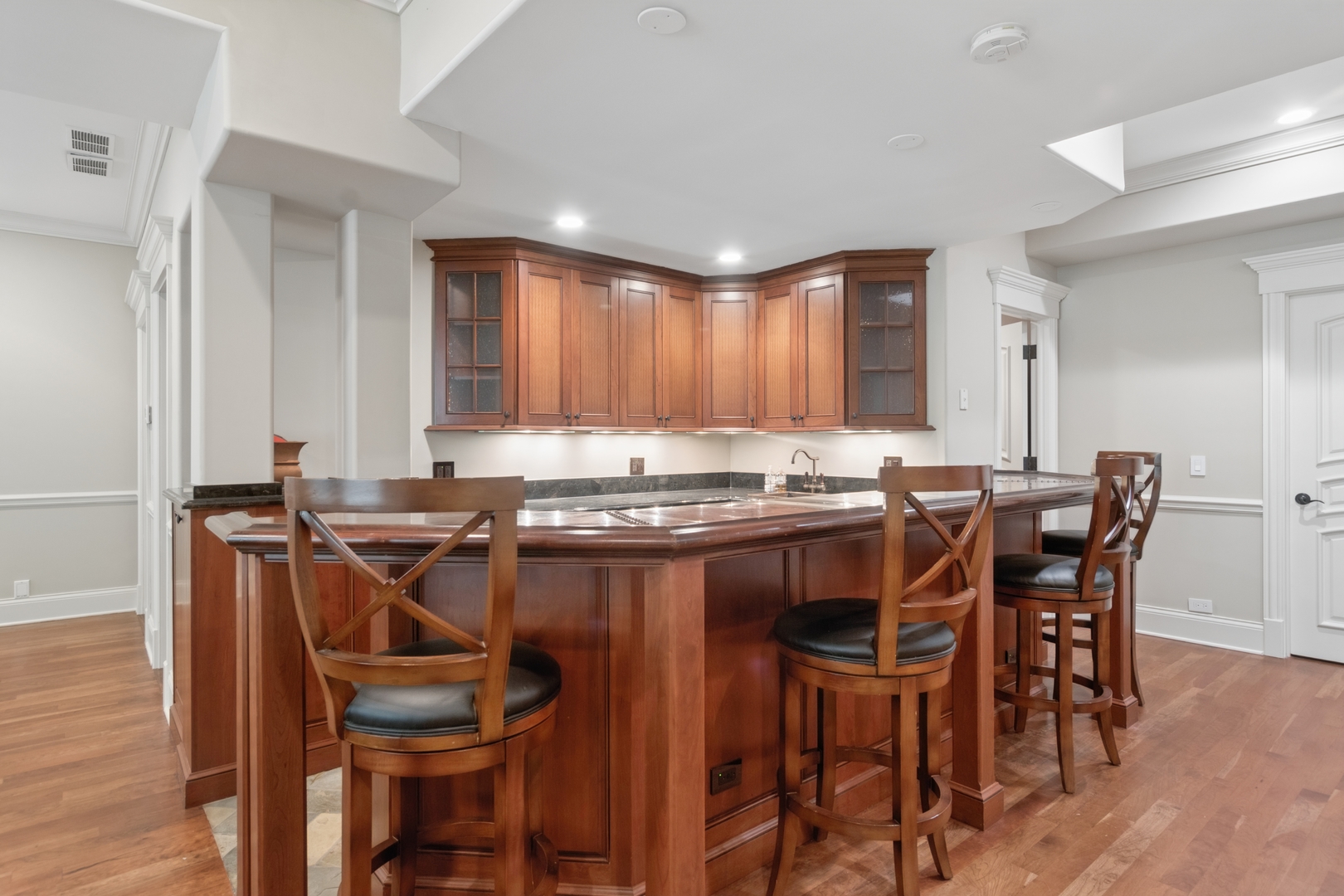 1128 Mt Pleasant Road Winnetka, IL 60093 - Photo 42 of 58 a view of a dining room with furniture and wooden floor