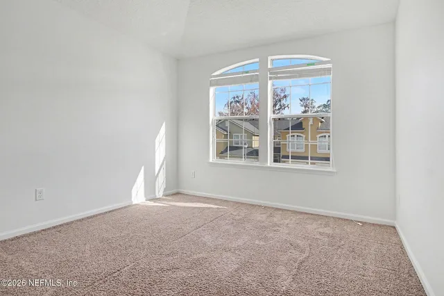 a view of empty room with front door