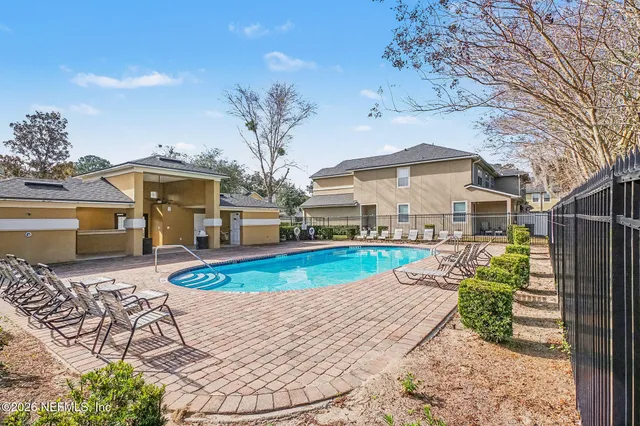 a view of a house with swimming pool