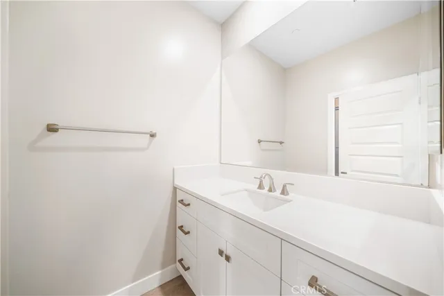 a view of a lake with boats and palm trees