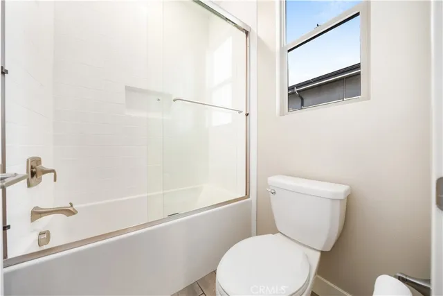 a view of a house with a big yard and large trees