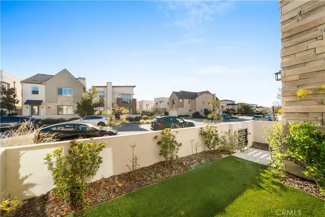 a living room with fireplace furniture and a wooden floor
