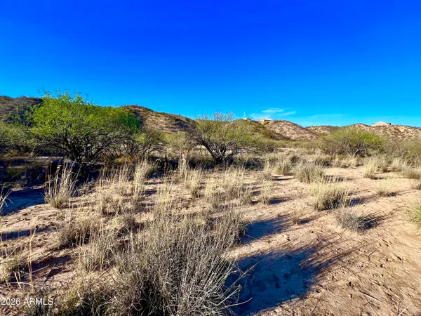 a view of a city with mountains in the background