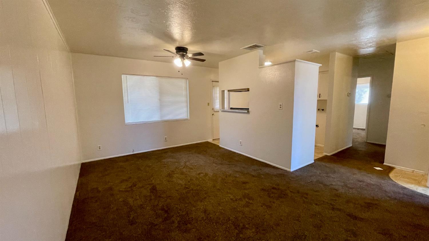 1412 Rodgers Road Hanford, CA 93230 - Photo 3 of 9 a view of an empty room with a window