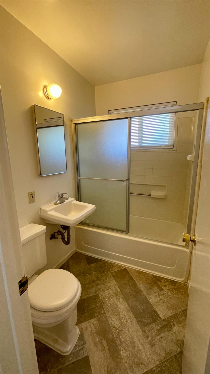 1412 Rodgers Road Hanford, CA 93230 - Photo 9 of 9 a bathroom with a toilet sink and shower