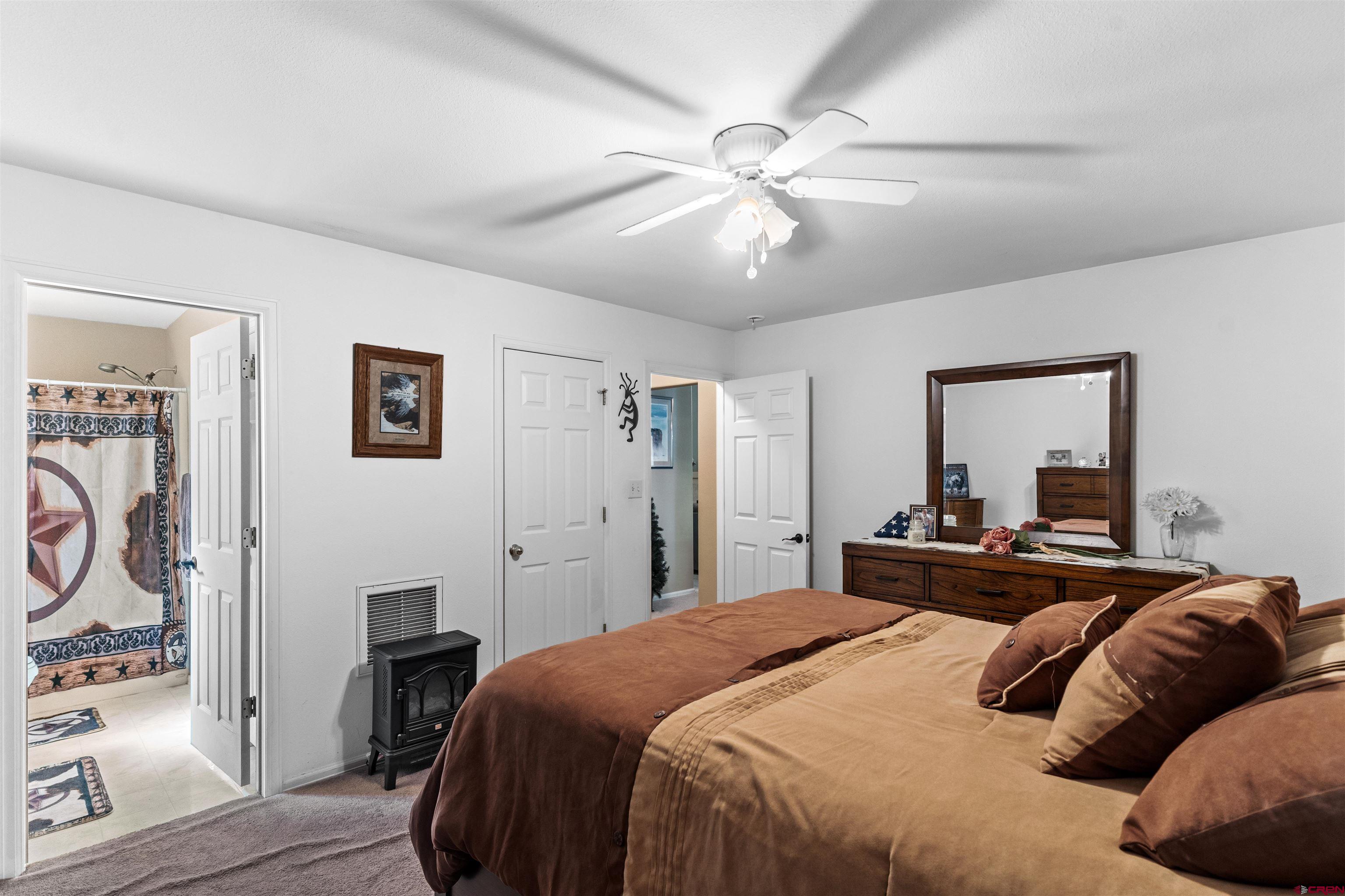 505 20th Street Delta, CO 81416 - Photo 12 of 22 a bedroom with a bed and wooden floor