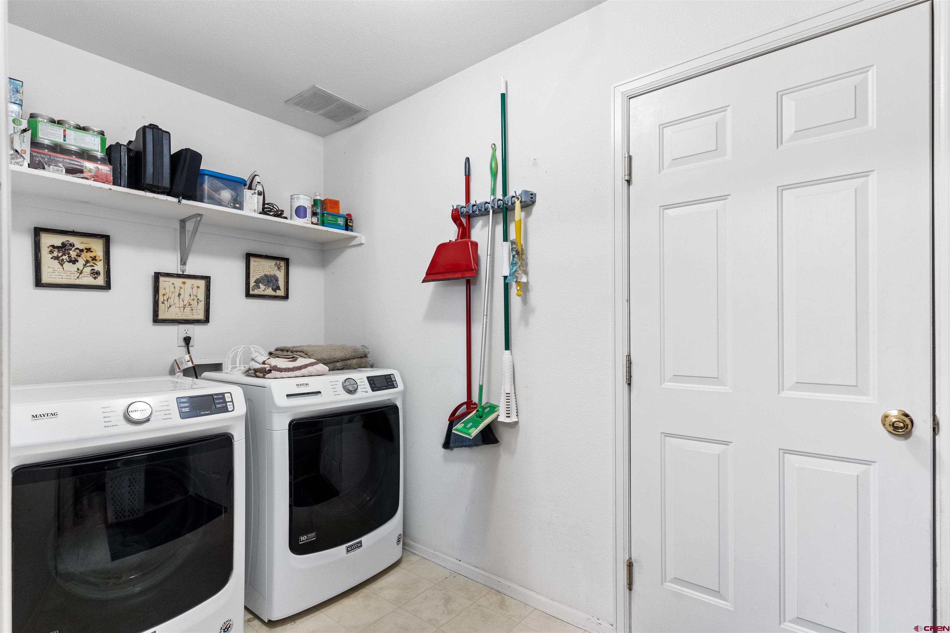 505 20th Street Delta, CO 81416 - Photo 17 of 22 a view of a livingroom with washer and dryer